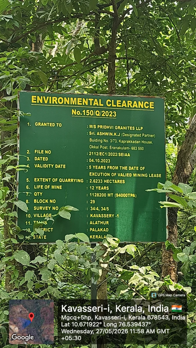 Green signboard displaying environmental clearance permit details at the site entrance