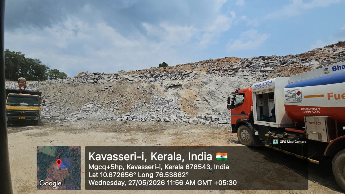 Active granite quarry site showing extraction pit and transportation machinery